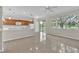 Open-concept kitchen and dining space features natural light and a scenic view at 10836 Tilston Pt, Orlando, FL 32832