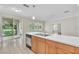 This open kitchen offers an island sink with a view of the lake at 10836 Tilston Pt, Orlando, FL 32832