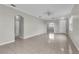 Bright and open living room features tile flooring and neutral paint, ready for personalization at 10836 Tilston Pt, Orlando, FL 32832