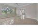Tile flooring, bright natural light, and a seamless transition to other rooms at 10836 Tilston Pt, Orlando, FL 32832