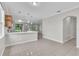 Open-concept living and dining area with tile floors, pendant lighting and easy access to outdoor living at 10836 Tilston Pt, Orlando, FL 32832