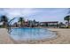 Community splash zone featuring colorful water features and palm trees, perfect for Gathering fun at 10836 Tilston Pt, Orlando, FL 32832