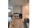 Open dining room with modern chandelier, bar cabinet, and neutral décor at 11097 N Folklore St, Winter Garden, FL 34787