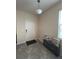 Bright entryway with a stylish bench, decorative pillows, and tiled flooring at 11097 N Folklore St, Winter Garden, FL 34787