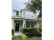 Home exterior with covered porch, manicured landscaping, and stylish facade at 11097 N Folklore St, Winter Garden, FL 34787