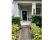 Home's facade with a well maintained lawn and decorative hedges at 11097 N Folklore St, Winter Garden, FL 34787