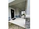 Inviting front porch with neutral color palette and plenty of seating for relaxing at 11097 N Folklore St, Winter Garden, FL 34787