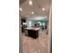 Modern kitchen with a central island, stainless steel appliances, and open views to the living area at 11097 N Folklore St, Winter Garden, FL 34787