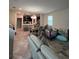 Open-concept living area showcasing tile floors, a dining area, and an adjacent kitchen at 11097 N Folklore St, Winter Garden, FL 34787