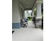 Spacious covered porch with outdoor seating and decorative stone accents at 11097 N Folklore St, Winter Garden, FL 34787
