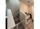 Hallway area with staircase leading up to the second floor, accented by a bar cabinet at 11097 N Folklore St, Winter Garden, FL 34787