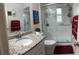 Elegant bathroom features granite countertop, vanity, toilet, and stand-up shower at 114 Madeira Ave, Orlando, FL 32825
