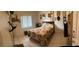 Cozy bedroom with tiled floors, a comfortable bed, and personal touches at 114 Madeira Ave, Orlando, FL 32825