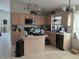 Functional kitchen with ample counter space, an island, and wooden cabinetry for storage at 12938 Maribou Cir, Orlando, FL 32828