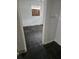 View of a damaged, empty bedroom with peeling paint and damaged floors through a doorway at 134 Flamingo Dr, Auburndale, FL 33823