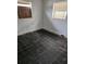 Empty bedroom with damaged walls, peeling paint, and boarded-up windows at 134 Flamingo Dr, Auburndale, FL 33823