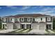 Attractive new construction townhomes featuring modern design and individual garages at 134 River Front Way, Edgewater, FL 32141