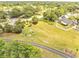 Aerial view of open space and walking path, with fitness stations and benches at 13404 Bradwater Ct, Orlando, FL 32828