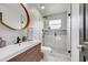 This remodeled bathroom features a glass shower and a vessel sink with wood vanity at 13404 Bradwater Ct, Orlando, FL 32828