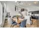 Spacious open-concept view of the dining room, kitchen, and living room at 13404 Bradwater Ct, Orlando, FL 32828
