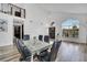 Dining room with hard-surface flooring, a modern table and chairs, and natural light at 13404 Bradwater Ct, Orlando, FL 32828