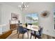 Bright dining room featuring modern lighting, stylish furniture, and large windows at 13404 Bradwater Ct, Orlando, FL 32828