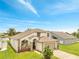 Charming two-story home featuring an attached two-car garage and well-manicured lawn and landscaped yard at 13404 Bradwater Ct, Orlando, FL 32828