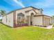 Charming two-story home featuring an attached two-car garage and well-manicured lawn and landscape at 13404 Bradwater Ct, Orlando, FL 32828