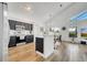 Modern kitchen featuring stainless steel appliances, dark cabinets, and breakfast bar at 13404 Bradwater Ct, Orlando, FL 32828