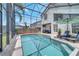 Large, private screened pool area with ample seating and a beautifully landscaped backyard at 13404 Bradwater Ct, Orlando, FL 32828