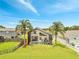 An inviting screened-in pool and backyard, perfect for outdoor entertaining, with tall palm trees at 13404 Bradwater Ct, Orlando, FL 32828