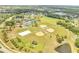 Aerial shot of community park boasting baseball fields, tennis courts, volleyball court, and vast green space at 13404 Bradwater Ct, Orlando, FL 32828
