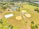 High angle showcases baseball fields, tennis courts, a volleyball court, and community park, offering endless fun at 13404 Bradwater Ct, Orlando, FL 32828