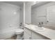 Hall bathroom with tub and shower combo and a sink with storage beneath at 142 Stonegate Pass, Davenport, FL 33897