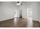 Large bedroom with high ceilings and wood floors has walk-in closet and ensuite bathroom with tub at 142 Stonegate Pass, Davenport, FL 33897