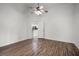 This bedroom has sleek wood floors, natural light, and access to a full kitchen at 142 Stonegate Pass, Davenport, FL 33897