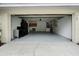 Spacious two car garage with painted floor, laundry hookups and extra storage at 142 Stonegate Pass, Davenport, FL 33897