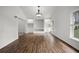 A living room features wood floors, recessed lights, and a built-in shelving and storage unit at 142 Stonegate Pass, Davenport, FL 33897