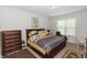 Comfortable bedroom featuring neutral colors and a window view at 1431 Leitrim Loop, Apopka, FL 32703