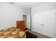 Comfortable bedroom with closet, dresser, and doorway to another room at 1431 Leitrim Loop, Apopka, FL 32703