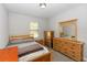 Well lit bedroom with neutral colors, carpet flooring and a window view at 1431 Leitrim Loop, Apopka, FL 32703