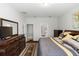 Comfortable bedroom featuring neutral colors and an ensuite bathroom at 1431 Leitrim Loop, Apopka, FL 32703