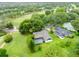 Aerial view of a home next to a golf course, surrounded by mature trees and landscaping at 1507 Golfside Dr, Winter Park, FL 32792