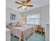 Bright bedroom with a large window allowing natural light, complete with a desk and ample storage at 1507 Golfside Dr, Winter Park, FL 32792
