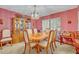 Dining room features traditional decor with decorative wallpaper, furniture, and lighting at 1507 Golfside Dr, Winter Park, FL 32792
