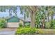 Charming single-story home featuring a lush front yard and attached two-car garage at 1507 Golfside Dr, Winter Park, FL 32792