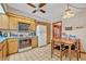 Quaint kitchen featuring blue countertops, wooden cabinets, and basic appliances at 1507 Golfside Dr, Winter Park, FL 32792