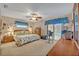 Comfortable main bedroom featuring a sliding glass door with pool views, complemented by a cozy sitting area at 1507 Golfside Dr, Winter Park, FL 32792
