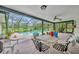 Enclosed patio with a ceiling fan, furniture, and direct access to the outdoor pool area at 1507 Golfside Dr, Winter Park, FL 32792