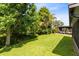 Secluded backyard with a covered patio, providing an ideal space for relaxation and entertainment at 15324 Black Lion Way, Winter Garden, FL 34787